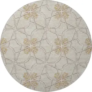 Photo of 8' Ivory Gold And Beige Geometric Washable Round Rug With UV Protection