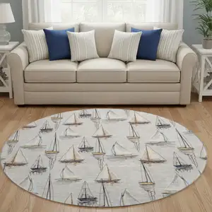 Photo of 8' Ivory Gold And Black Nautical Washable Round Rug With UV Protection