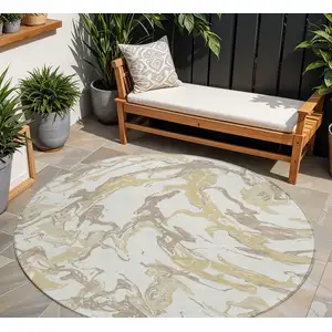 Photo of 8' Ivory Gold And Brown Round Abstract Washable Indoor Outdoor Area Rug