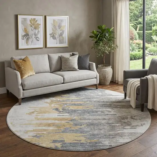 8' Ivory Gold And Gray Abstract Washable Round Rug With UV Protection Photo 1