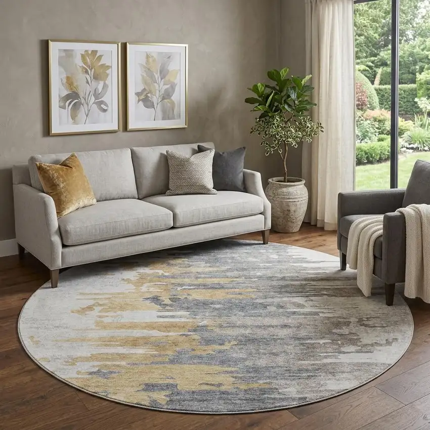 8' Ivory Gold And Gray Abstract Washable Round Rug With UV Protection Photo 1