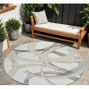 Photo of 8' Ivory Gray And Beige Round Abstract Washable Indoor Outdoor Area Rug