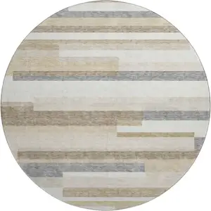Photo of 8' Ivory Gray And Beige Striped Washable Round Rug With UV Protection