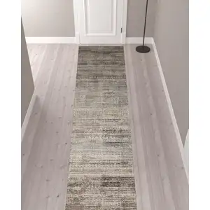 Photo of 12' Ivory Gray And Black Abstract Distressed Runner Rug With Fringe