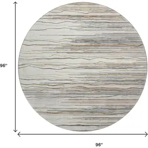 Photo of 8' Ivory Gray And Brown Striped Washable Round Rug With UV Protection