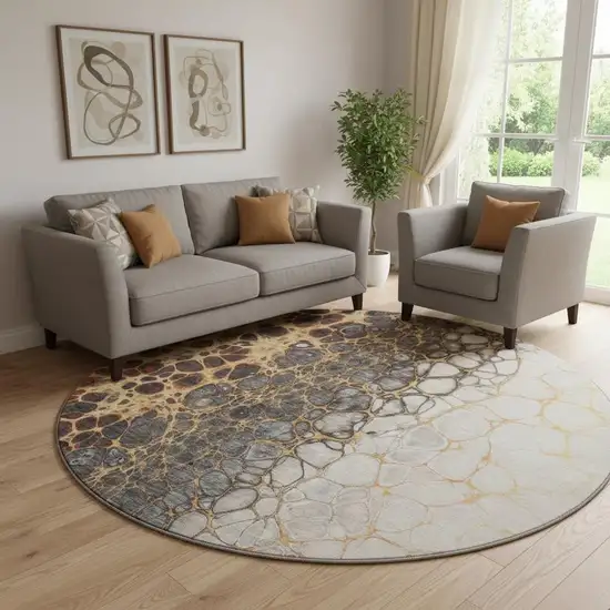 8' Ivory Gray And Gold Abstract Washable Round Rug With UV Protection Photo 1