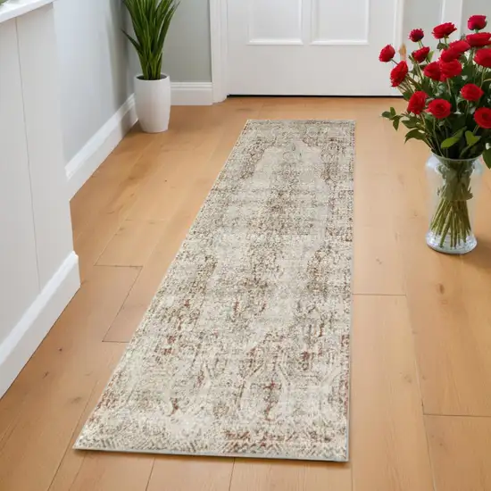 8' Ivory Gray and Brown Abstract Power Loom Worn Faded Runner Rug With Fringe Photo 1