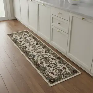 Photo of 8' Ivory Green And Red Oriental Runner Rug With Fringe