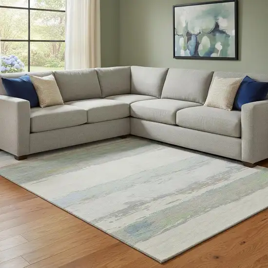 8' Ivory Mint Green And Teal Abstract Washable Area Rug With UV Protection Photo 2