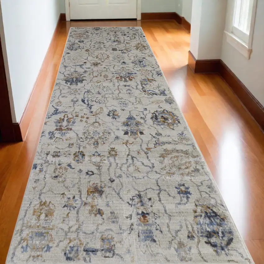 10' Ivory and Blue Floral Power Loom Distressed Non Skid Runner Rug Photo 1