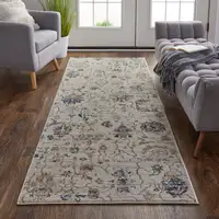 Photo of 12' Ivory Orange And Blue Floral Power Loom Distressed Runner Rug With Fringe