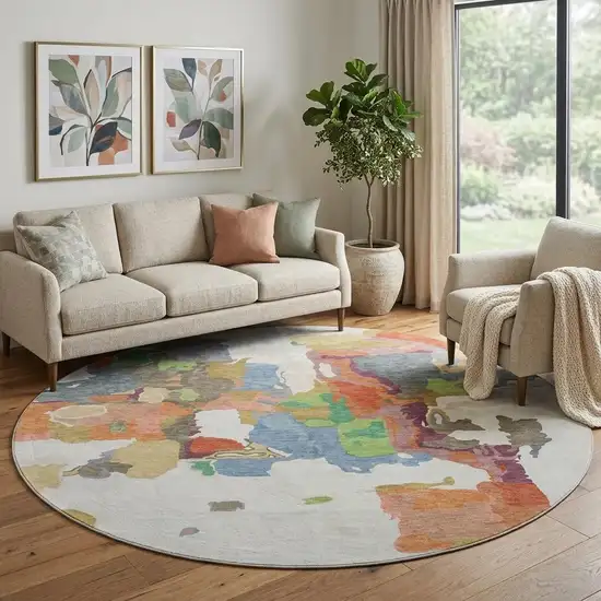 8' Ivory Orange Blue And Green Abstract Washable Round Rug With UV Protection Photo 1