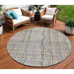 Photo of 8' Ivory Pink And Copper Round Striped Washable Indoor Outdoor Area Rug