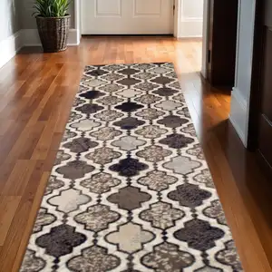 Photo of 11' Ivory Quatrefoil Power Loom Distressed Runner Rug