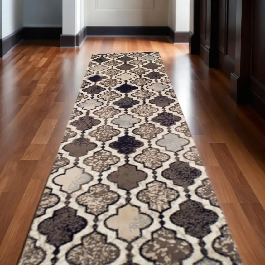 10' Ivory Brown And Black Quatrefoil Distressed Runner Rug Photo 1