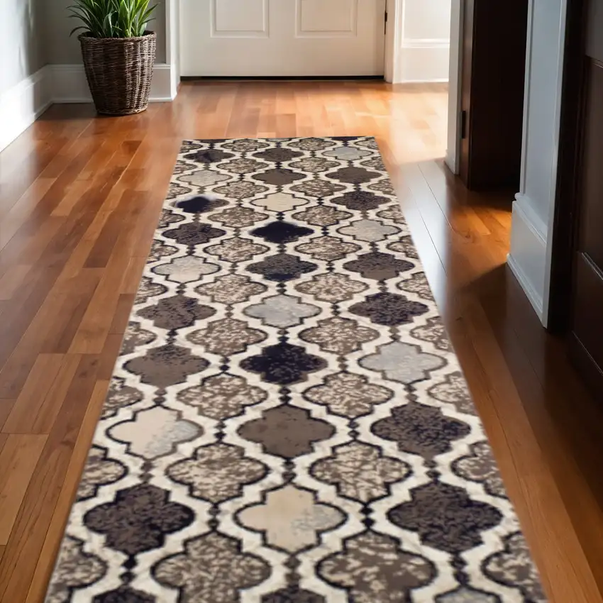 12' Ivory Brown And Black Quatrefoil Distressed Runner Rug Photo 1