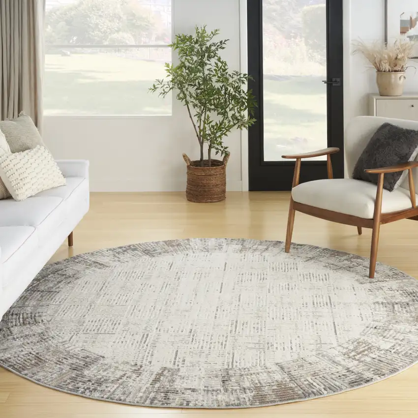 8' Ivory Round Abstract Power Loom Area Rug Photo 6
