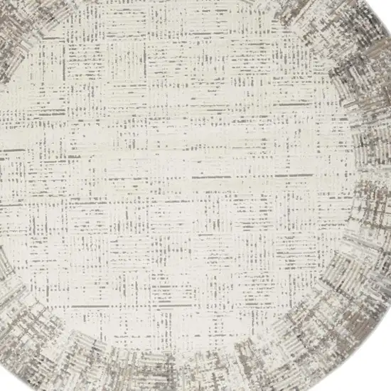 8' Ivory Round Abstract Power Loom Area Rug Photo 1