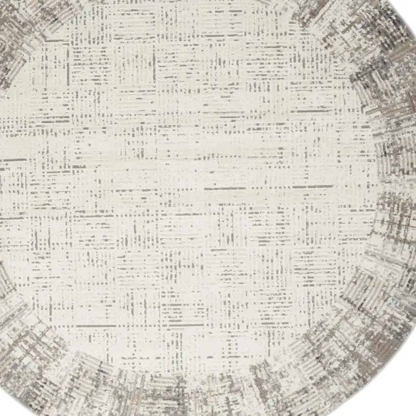 8' Ivory Round Abstract Power Loom Area Rug Photo 1