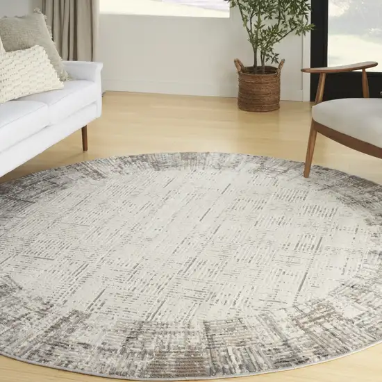 8' Ivory Round Abstract Power Loom Area Rug Photo 5