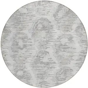 Photo of 8' Ivory Silver And Taupe Round Abstract Washable Indoor Outdoor Area Rug