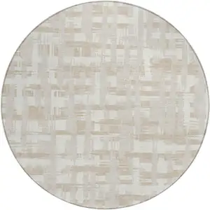 Photo of 8' Ivory Tan And Beige Round Striped Washable Indoor Outdoor Area Rug