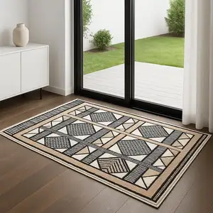 Photo of 6' Ivory Tan And Black Geometric Runner Rug