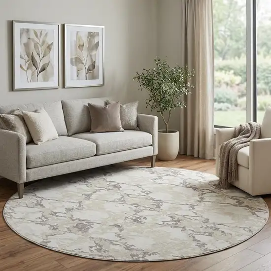 8' Ivory Taupe And Beige Abstract Washable Round Rug With UV Protection Photo 1