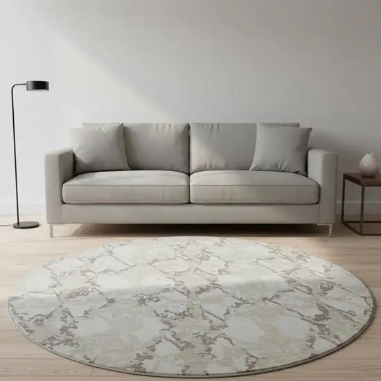 8' Ivory Taupe And Beige Abstract Washable Round Rug With UV Protection Photo 2