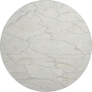 Photo of 8' Ivory Taupe And Gray Abstract Washable Round Rug With UV Protection