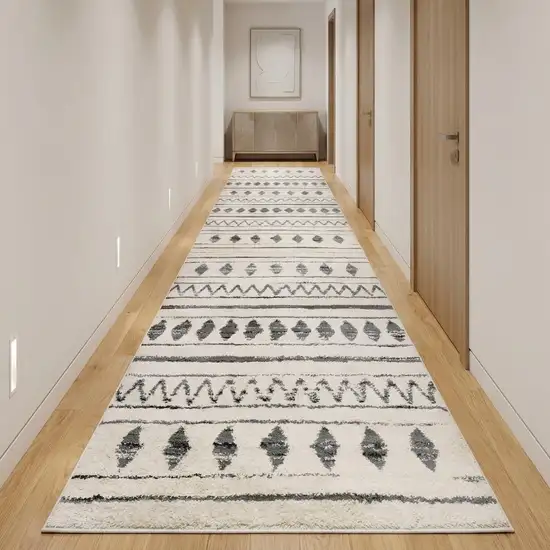 10' Cream Black And Gray Geometric Shag Runner Rug Photo 1