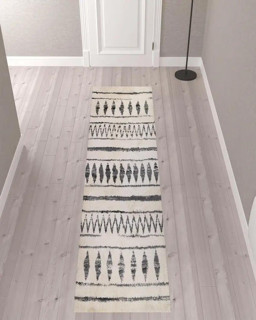 10' Ivory and Black Geometric Shag Runner Rug Photo 2