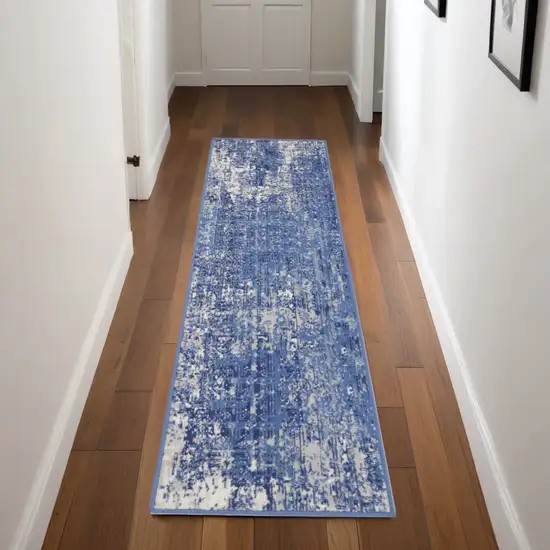 8' Ivory and Blue Abstract Distressed Non Skid Runner Rug Photo 1