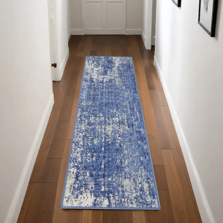 8' Ivory and Blue Abstract Distressed Non Skid Runner Rug Photo 1