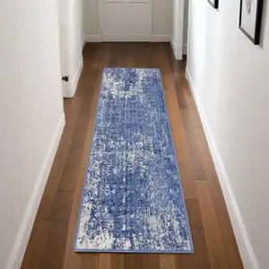 Photo of 8' Ivory and Blue Abstract Distressed Non Skid Runner Rug