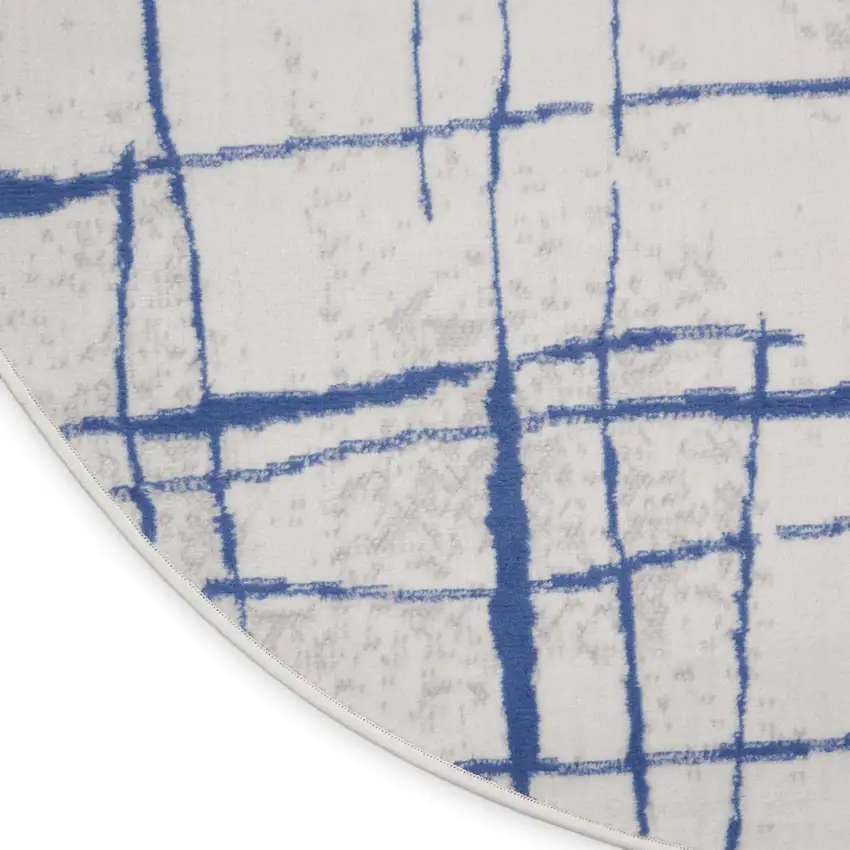 8' Ivory and Blue Abstract Distressed Round Rug Photo 9