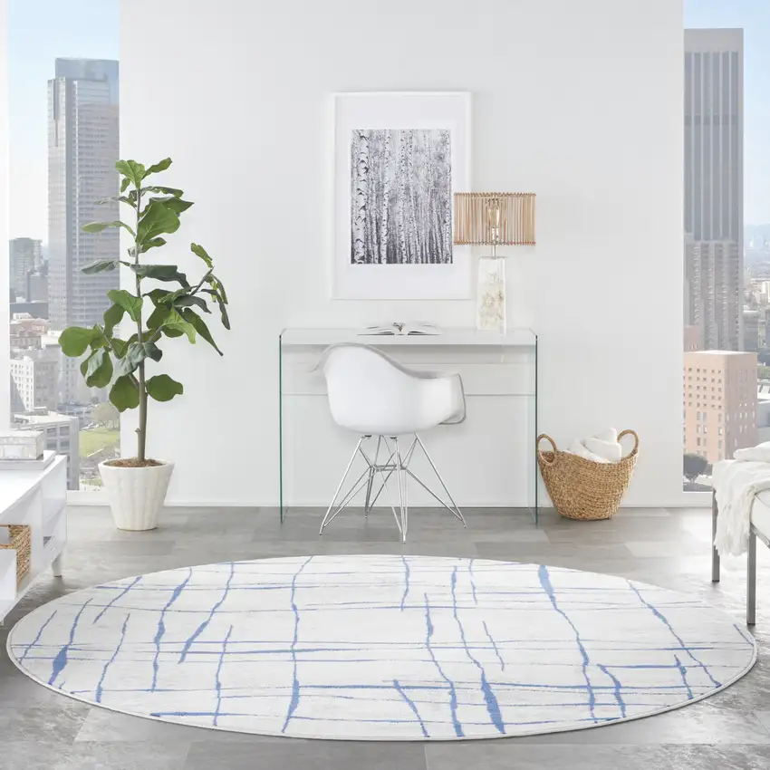 8' Ivory and Blue Abstract Distressed Round Rug Photo 5