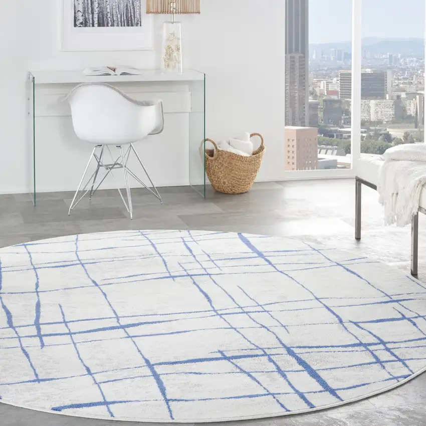 8' Ivory and Blue Abstract Distressed Round Rug Photo 4