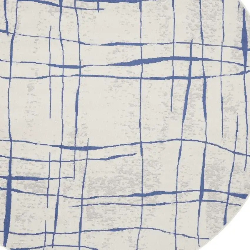 8' Ivory and Blue Abstract Distressed Round Rug Photo 7