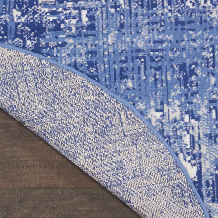 8' Ivory and Blue Abstract Distressed Round Rug Photo 7