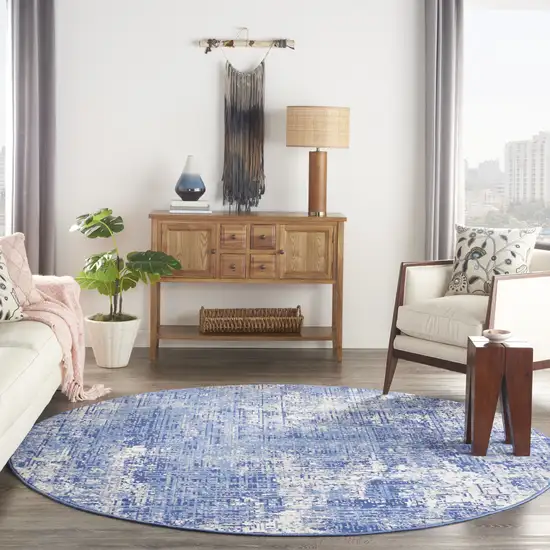 8' Ivory and Blue Abstract Distressed Round Rug Photo 7