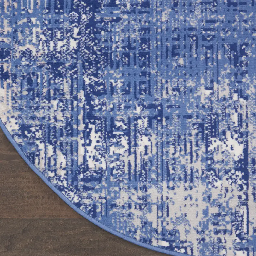 8' Ivory and Blue Abstract Distressed Round Rug Photo 8