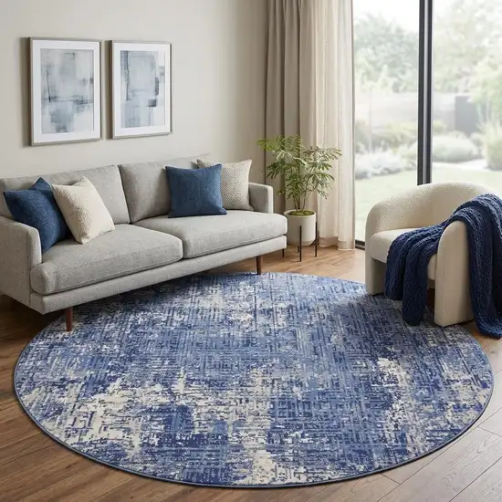 8' Ivory and Blue Abstract Distressed Round Rug Photo 1