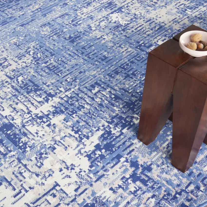 8' Ivory and Blue Abstract Distressed Round Rug Photo 6