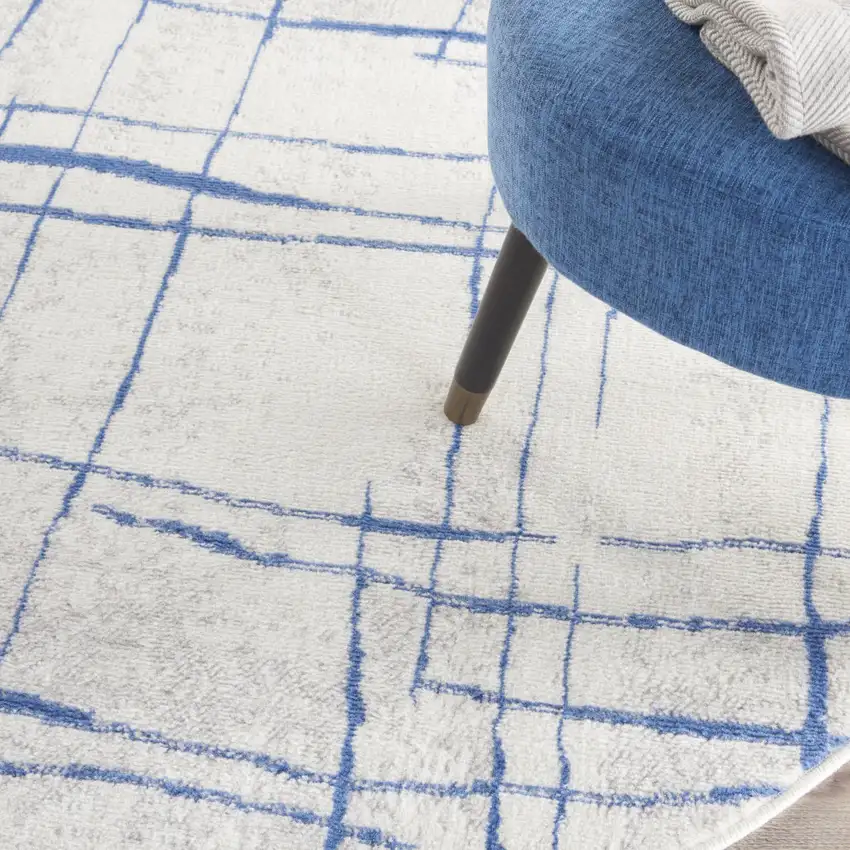 5' Ivory and Blue Abstract Geometric Distressed Round Rug Photo 9