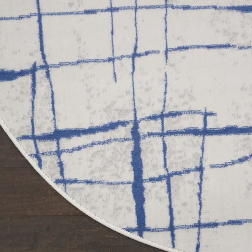 5' Ivory and Blue Abstract Geometric Distressed Round Rug Photo 4