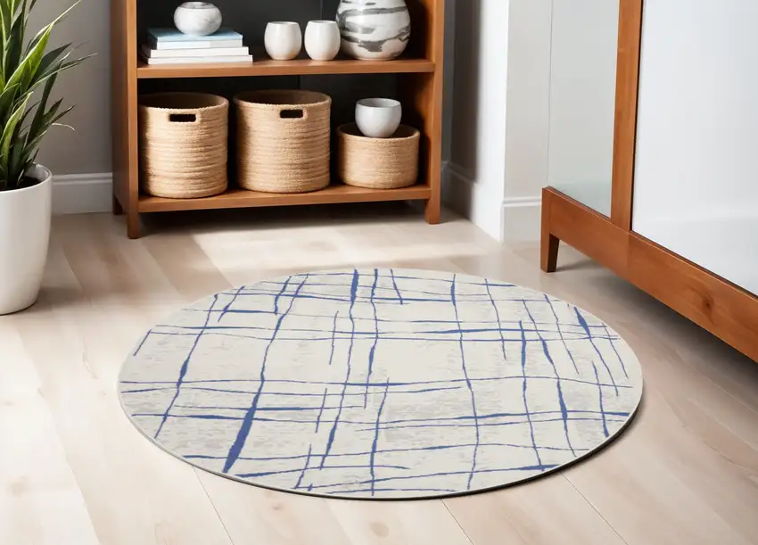 5' Ivory and Blue Abstract Geometric Distressed Round Rug Photo 1