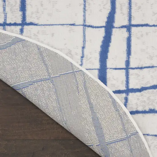 5' Ivory and Blue Abstract Geometric Distressed Round Rug Photo 9