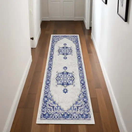 8' Ivory and Blue Floral Medallion Distressed Non Skid Runner Rug Photo 1