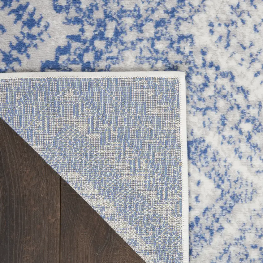 8' Ivory and Blue Geometric Distressed Non Skid Runner Rug Photo 9